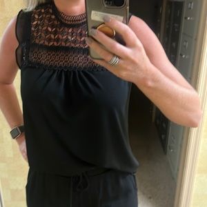 Black high neck blouse.